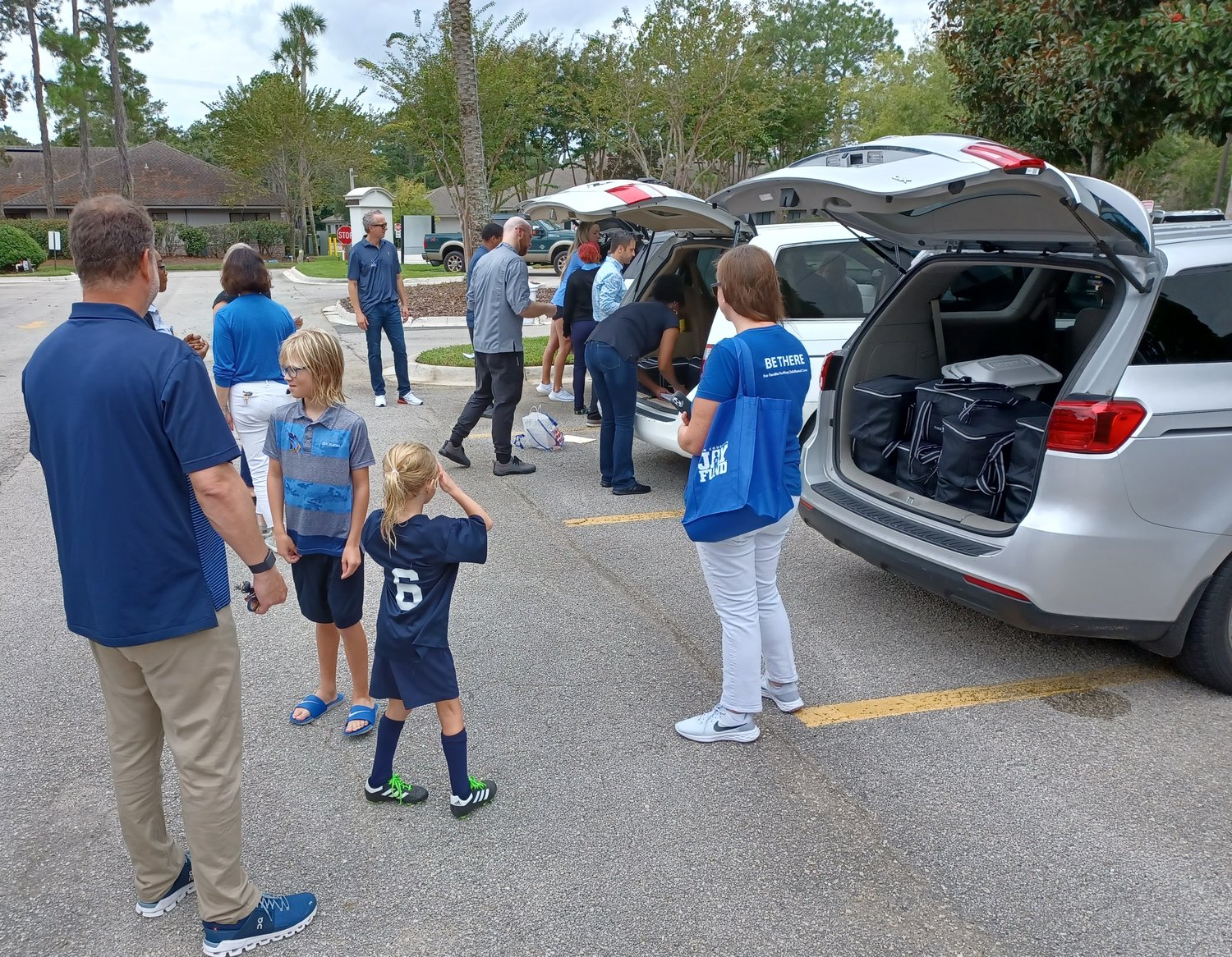 Volunteers pack automobiles with meals created for Jay Fund families by PGA TOUR Chef Eric Butcher and his team. The meals were delivered by volunteers to the families on Sept. 17.